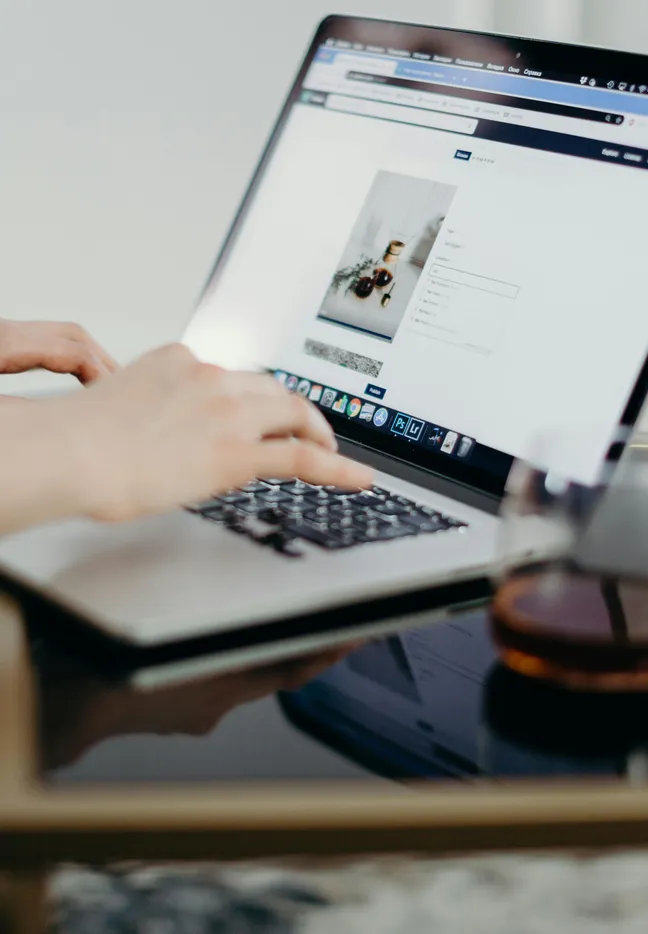 business owner updating their website on laptop