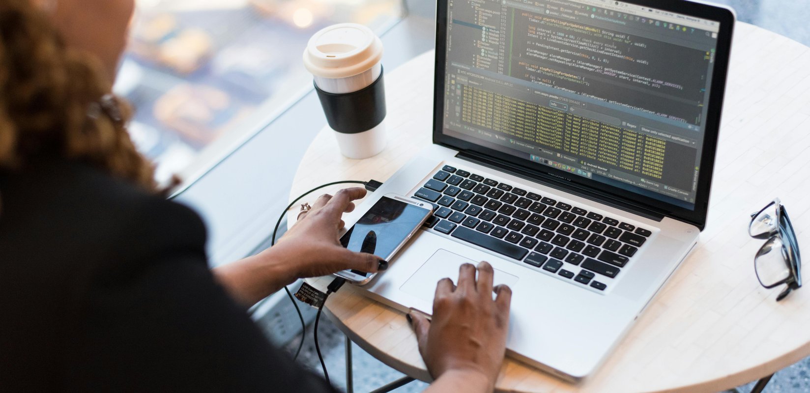 developer building a hand-coded contractor website on a laptop
