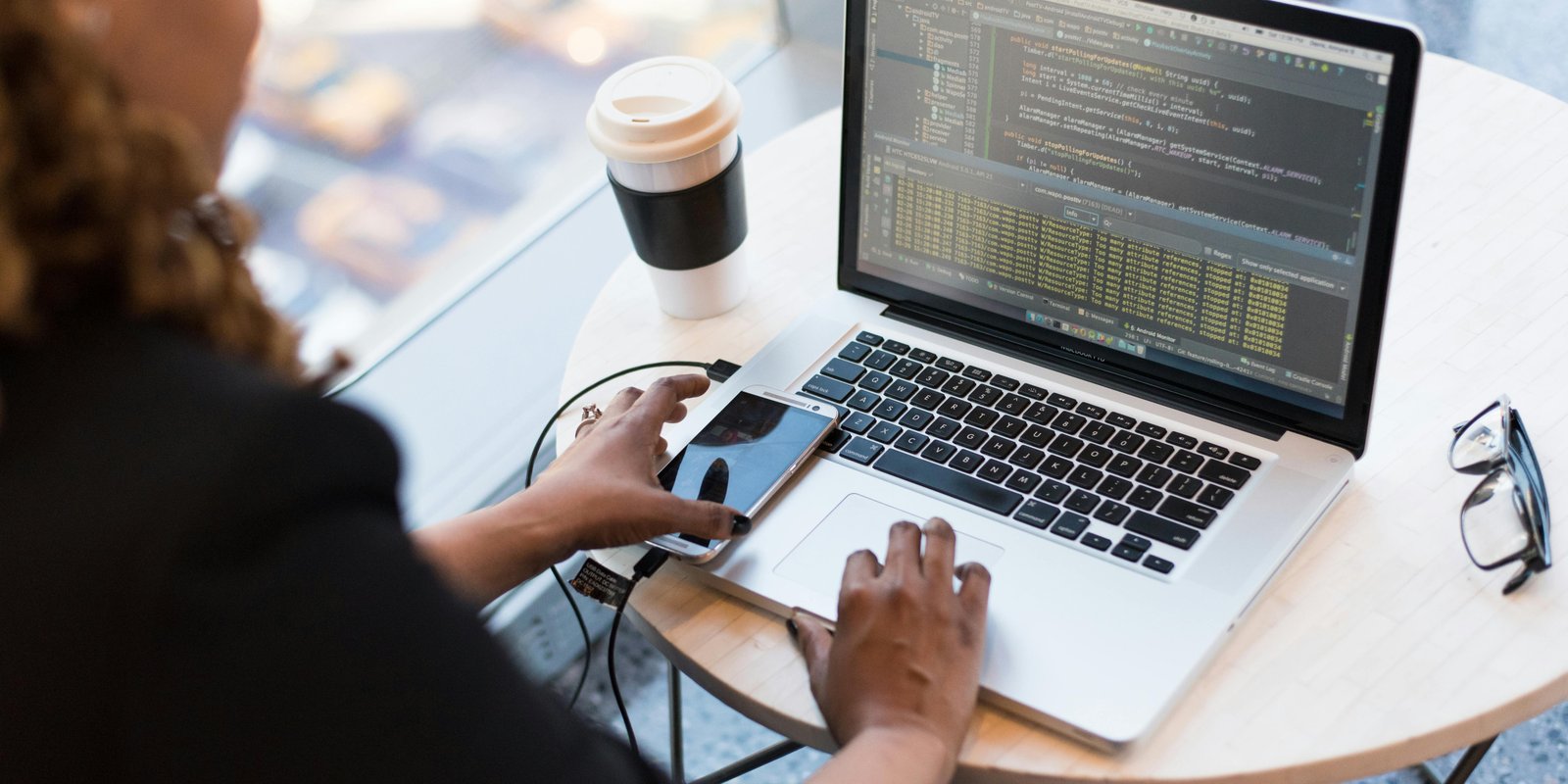 developer building a hand-coded contractor website on a laptop