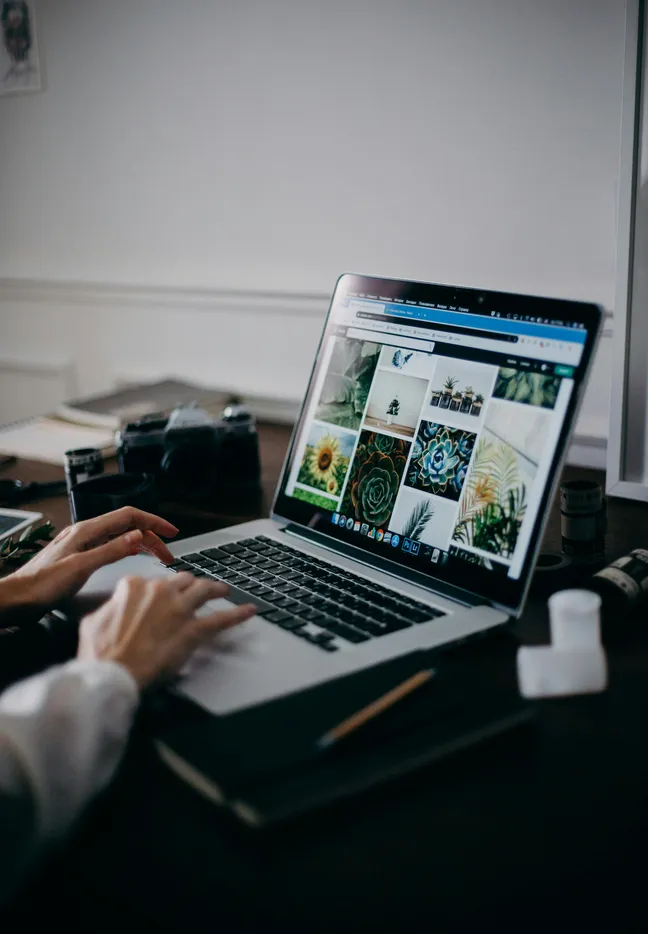 reviewing website design portfolio on laptop