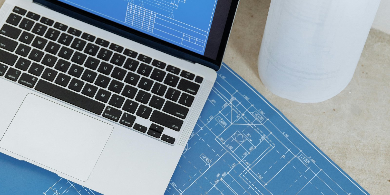 website planning notes and laptop for small business pricing